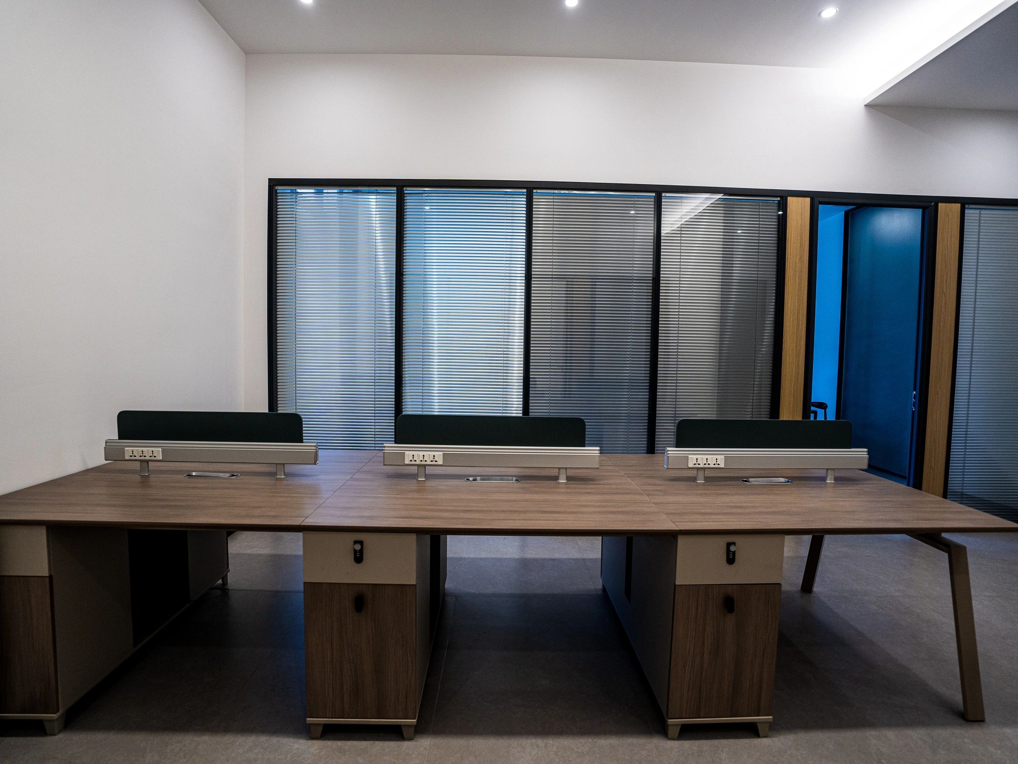 Custom wood-grain office workstations with integrated power